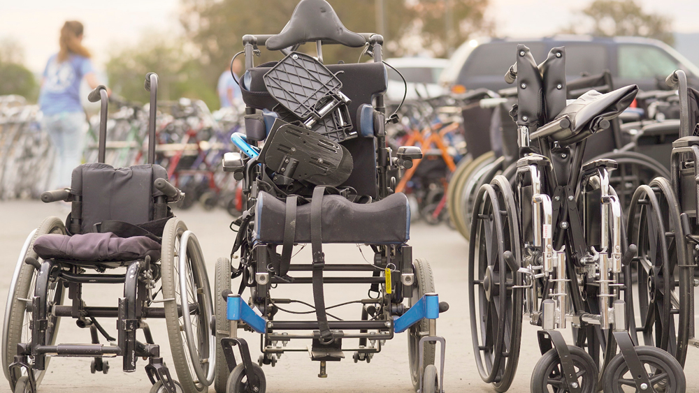 A row of donated manual wheelchairs