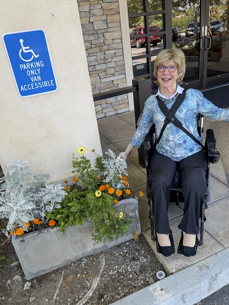 Joni next to her planter at the International Disability Center